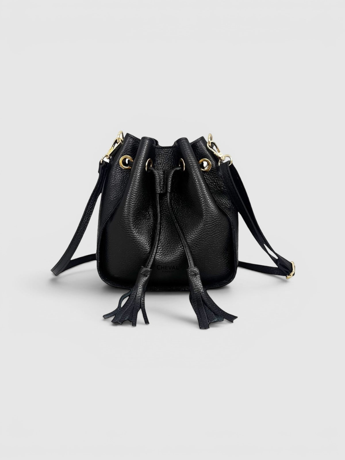 Cheval Firenze Matilde black leather bucket bag with tassel details and gold hardware.